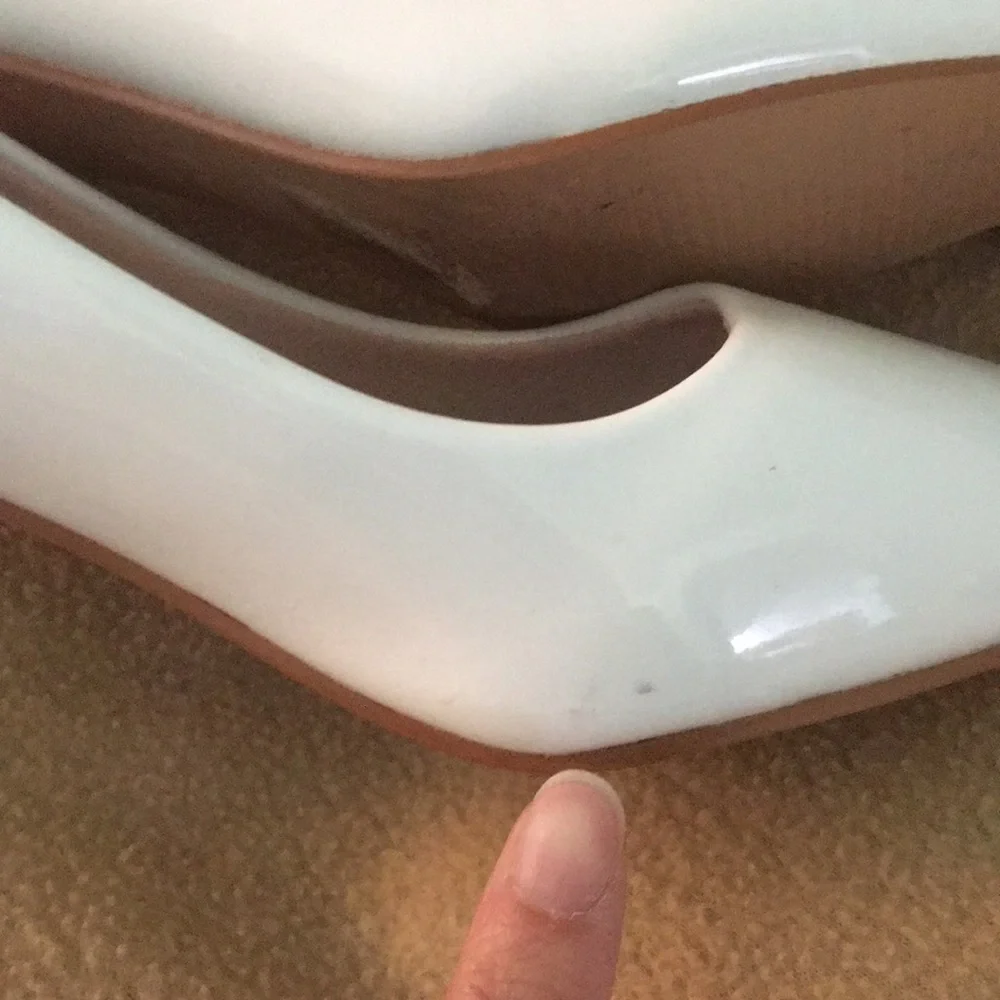 White patent pumps